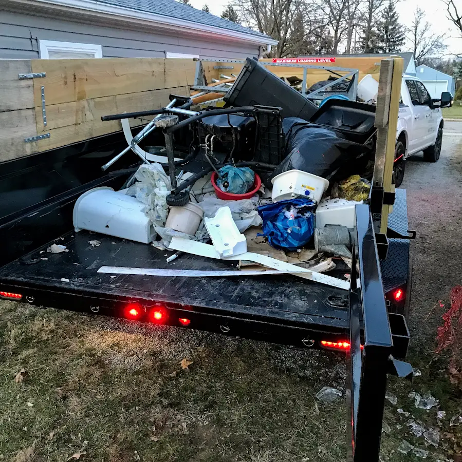 Roll-off dumpster delivered to a residential driveway in Kaplan