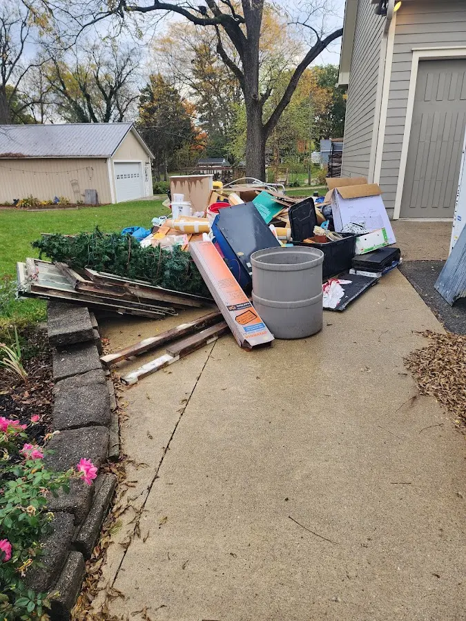 Dumpster being loaded with debris for Demolition Dumpster Rental in Kaplan